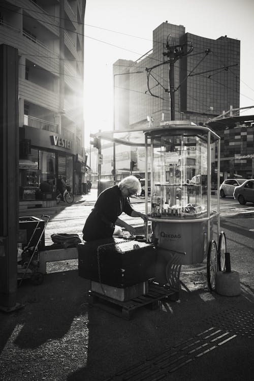 Black and White Photo of a Street Vendor