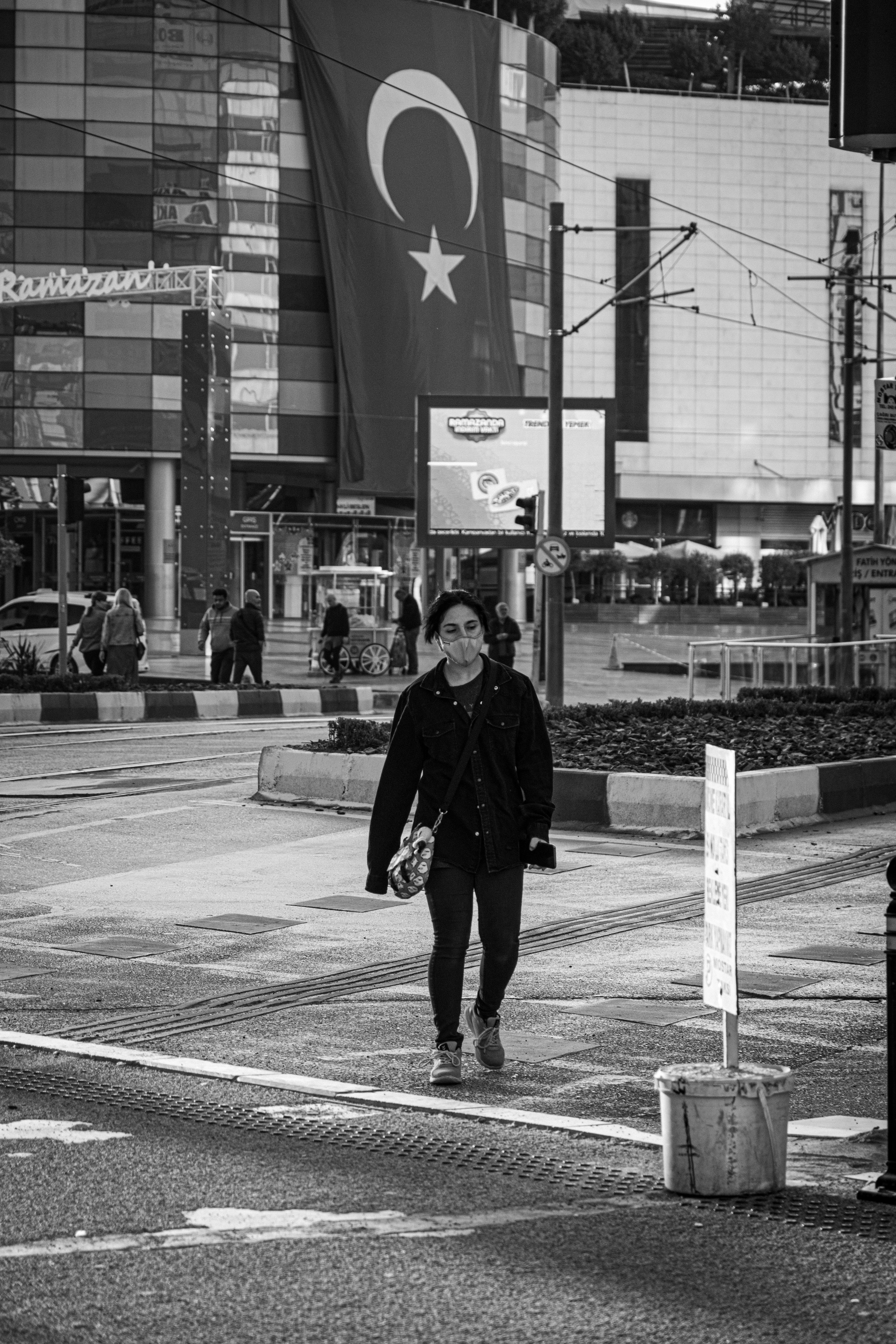 Black and White Photo of a Man Walking on the Street · Free Stock Photo
