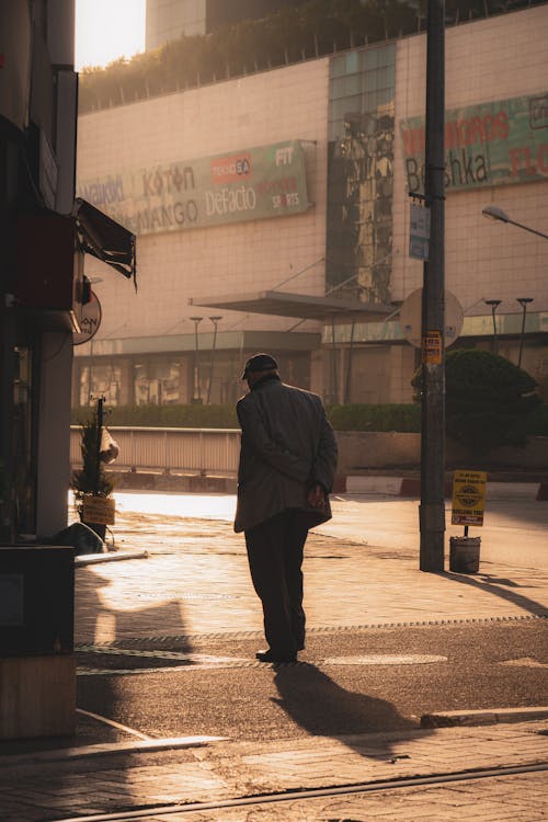 Free Man Walking in Town Stock Photo