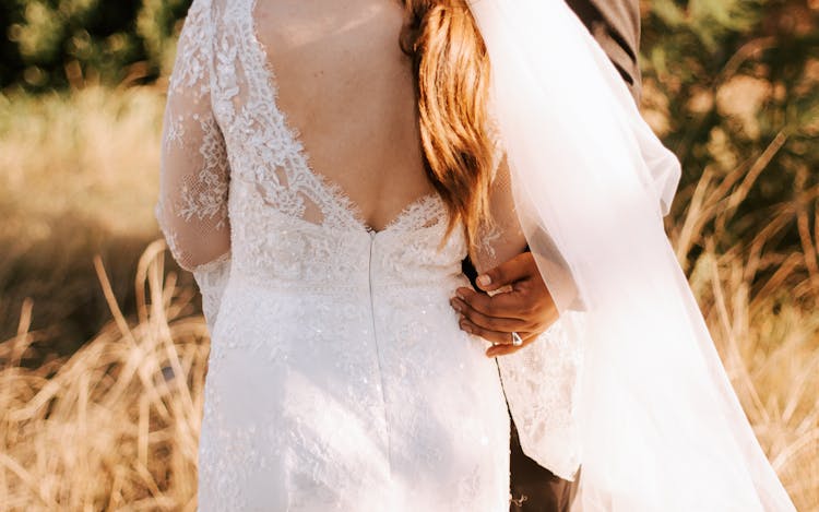 Back View Of A Woman Wearing A Wedding Dress