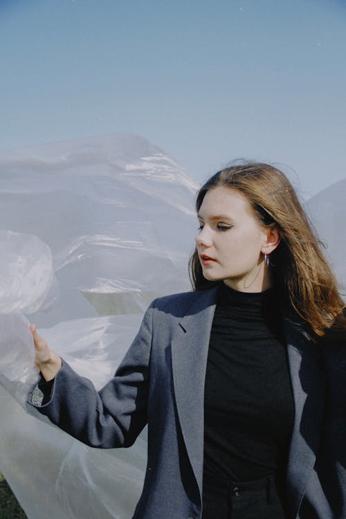 Beautiful Woman Holding Plastic