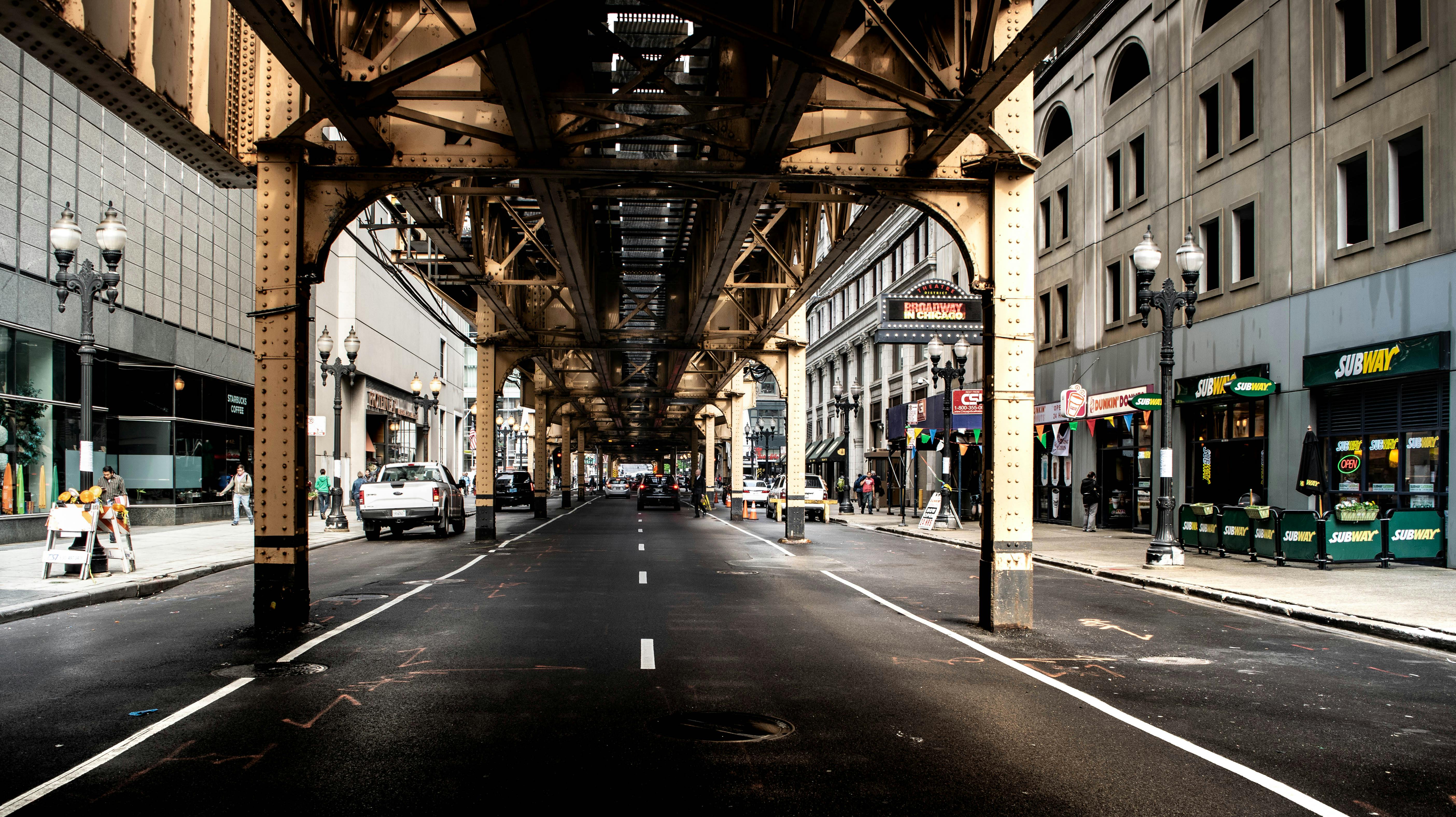 black and brown underground road with concrete buildings