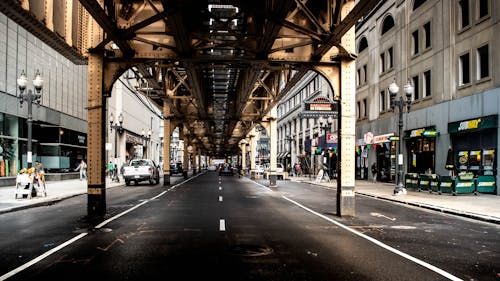 Black and Brown Underground Road With Concrete Buildings