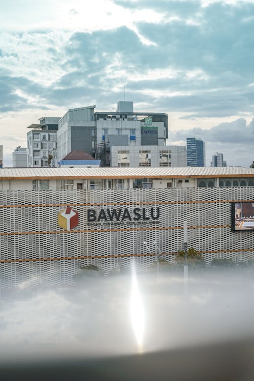 Free BAWASLU sign board mounted outside the office wall, BAWASLU is an abbreviation of the Indonesian election supervisory board known as Badan Pengawas Stock Photo