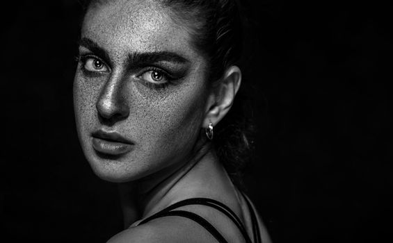 Artistic monochrome portrait capturing a woman's expressive features.