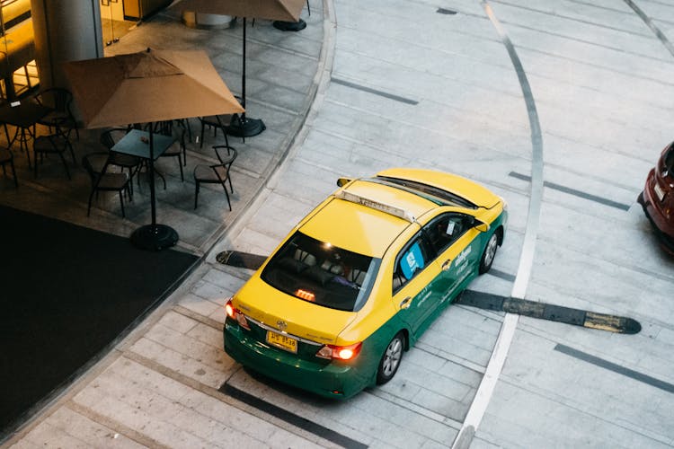 Aerial View Of A Yellow And Green Taxi