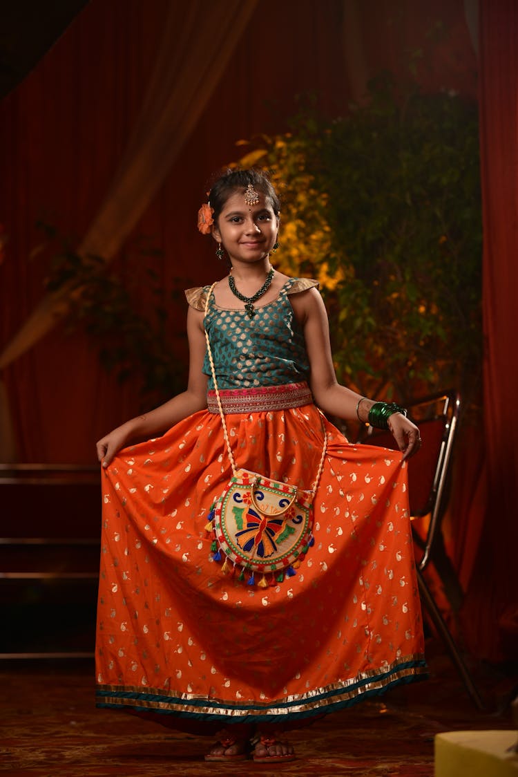 Cute Girl In A Orange And Green Dress