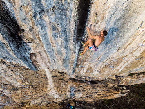 Partly Dressed Sport Climber Climbing Mountain Wall