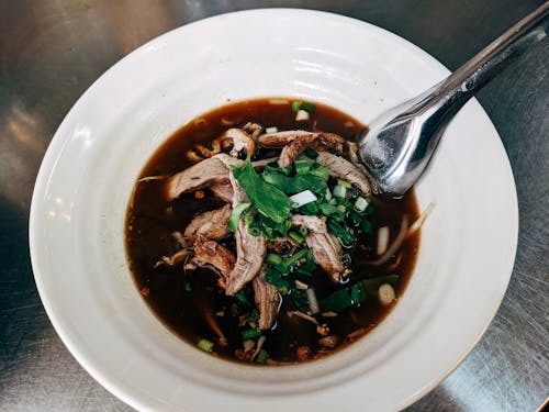 Cooked Meat with Soy Sauce on a Ceramic Bowl