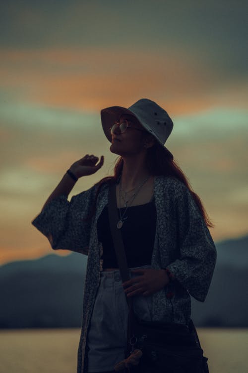Free Woman in Blue Denim Jacket and White Hat Stock Photo