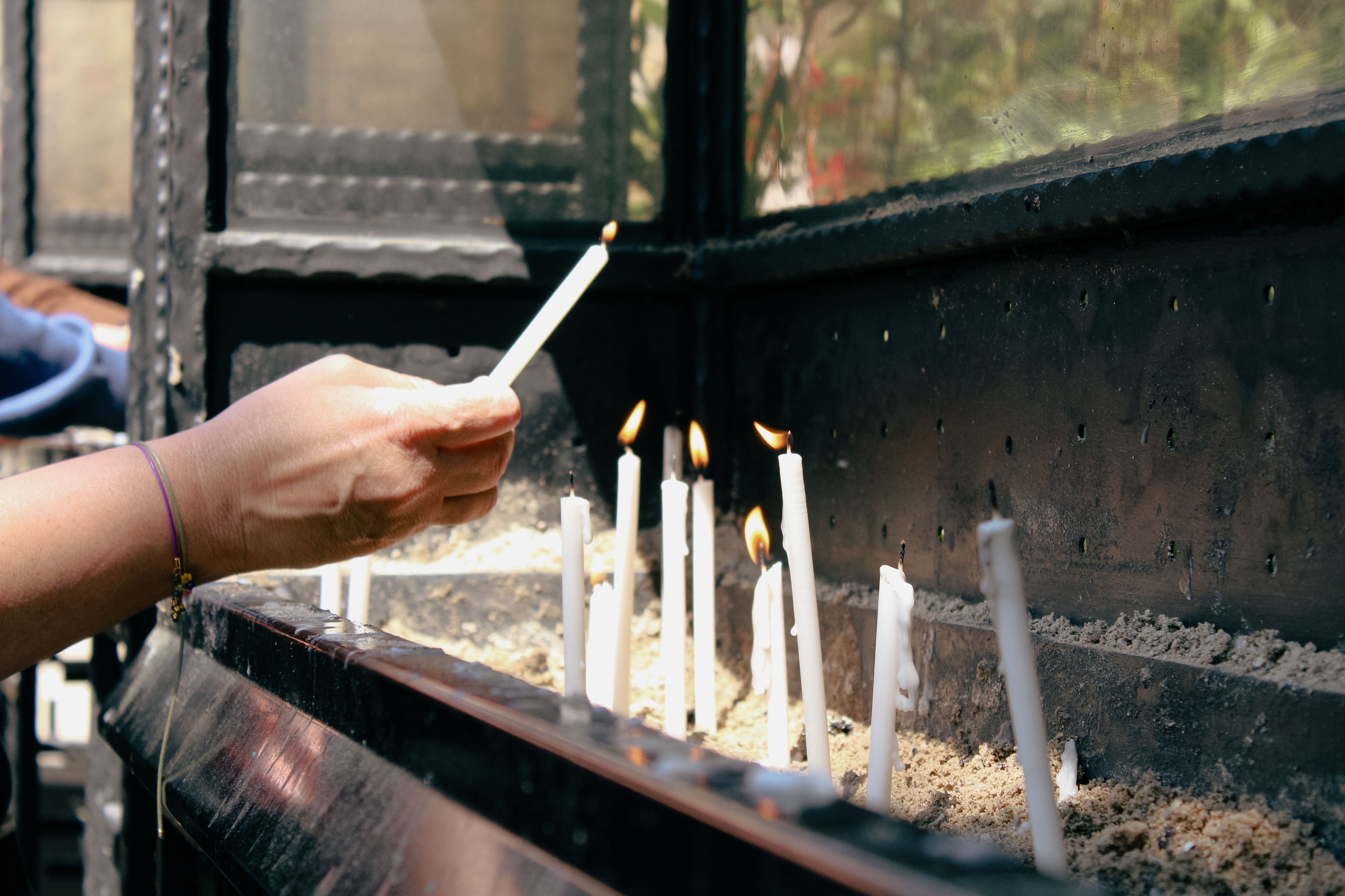 Person Holding White Lighted Candle · Free Stock Photo