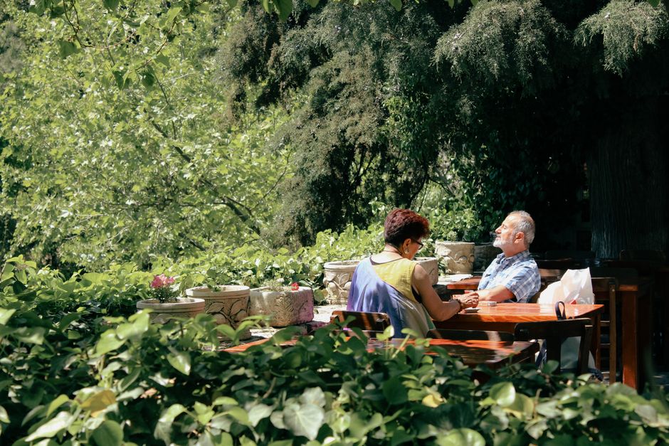 Seniors socializing outdoors in a quiet, low-maintenance 55+ community Seniors socializing outdoors in a quiet, low-maintenance 55+ community