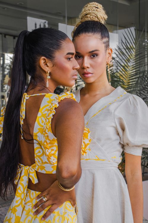 Free Two women posing in summer outfits, showcasing contemporary fashion and elegance. Stock Photo