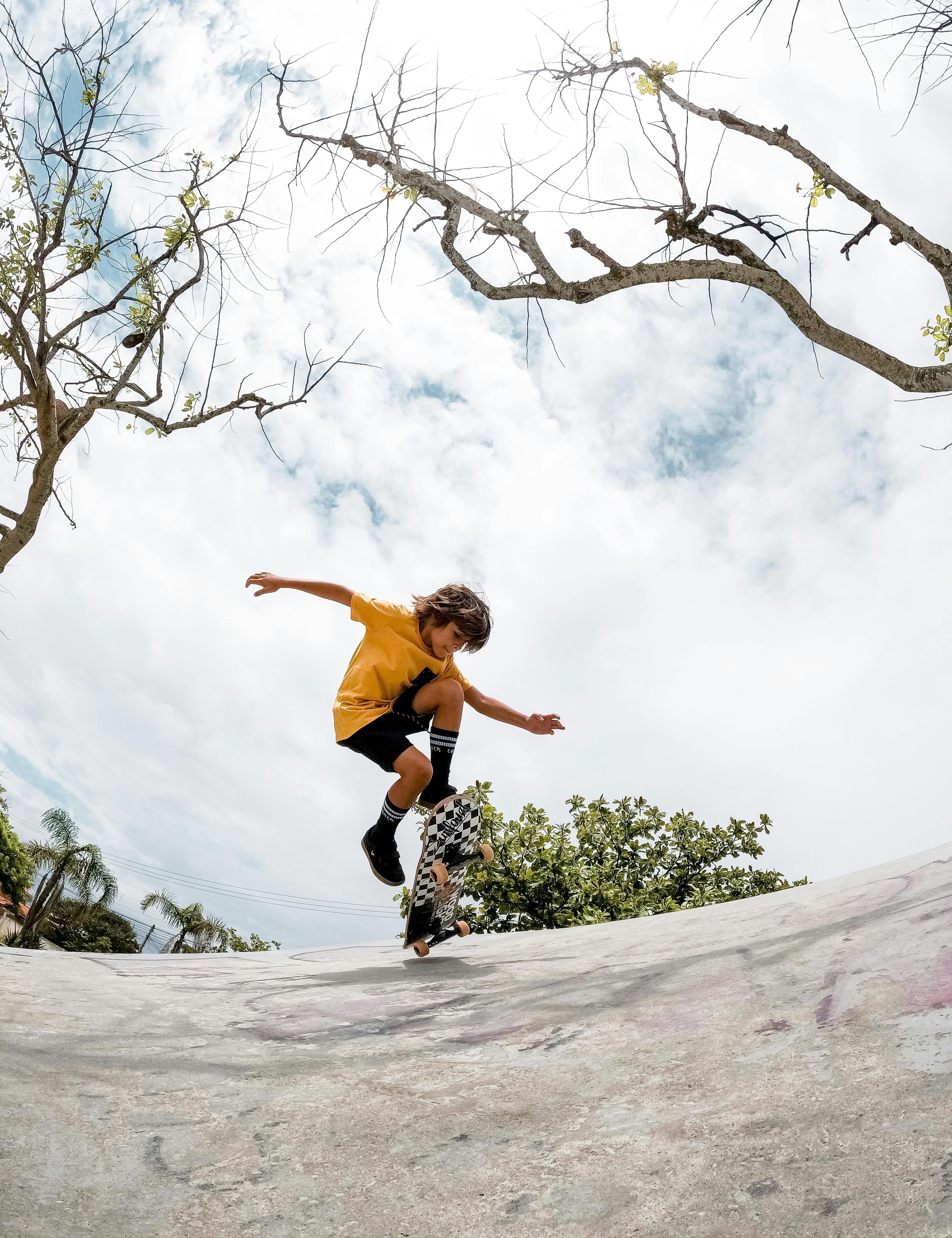 Teenager in a Bus with a Skateboard Eating Strawberries · Free Stock Photo