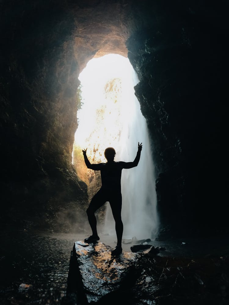 Silhouette Of Man In A Cave