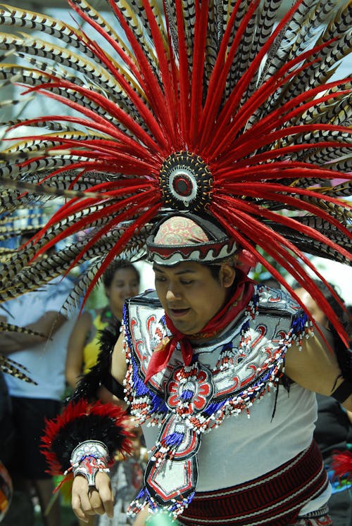 Free A man Wearing a Colorful Headdress in a Parade Stock Photo