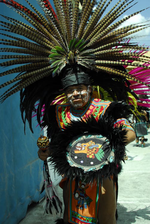 Man Wearing a Feather Headdress · Free Stock Photo