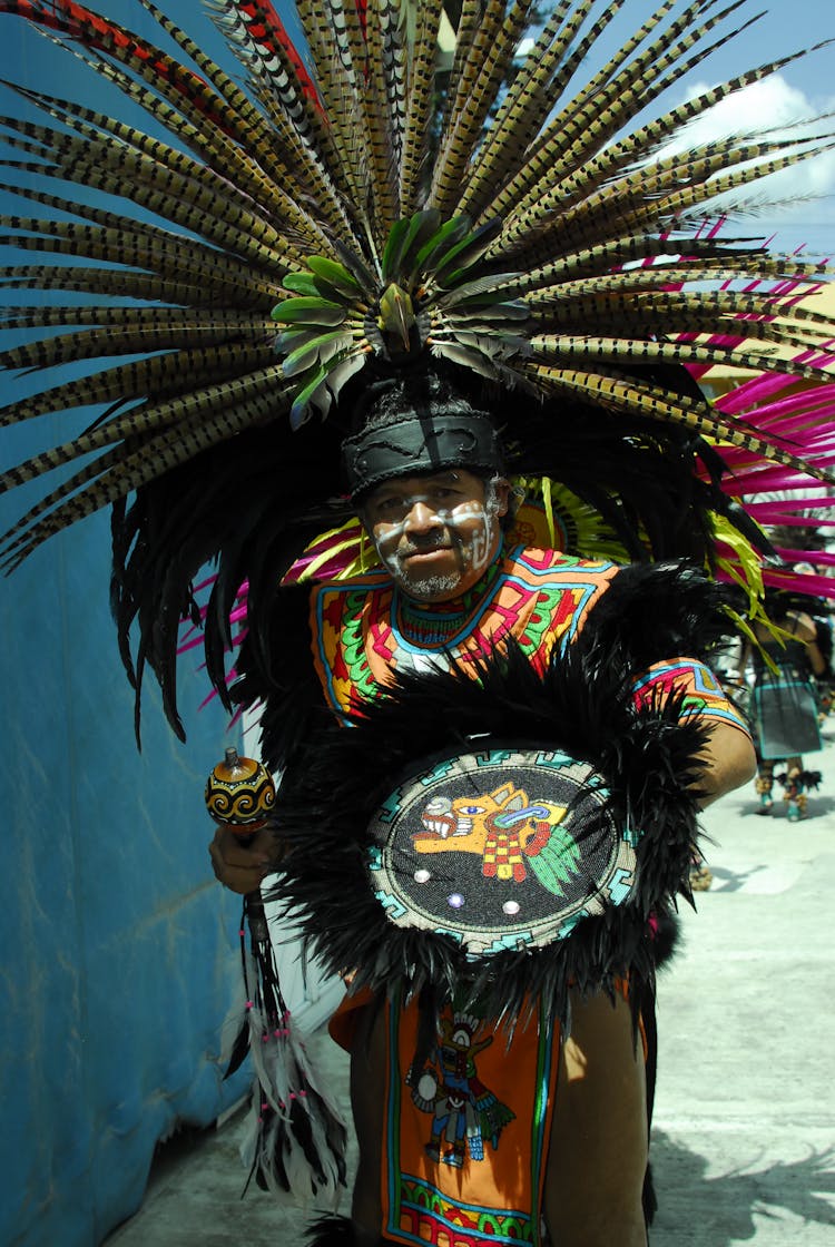 Man Wearing A Feather Headdress