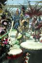 People in Traditional Dress Playing Drum