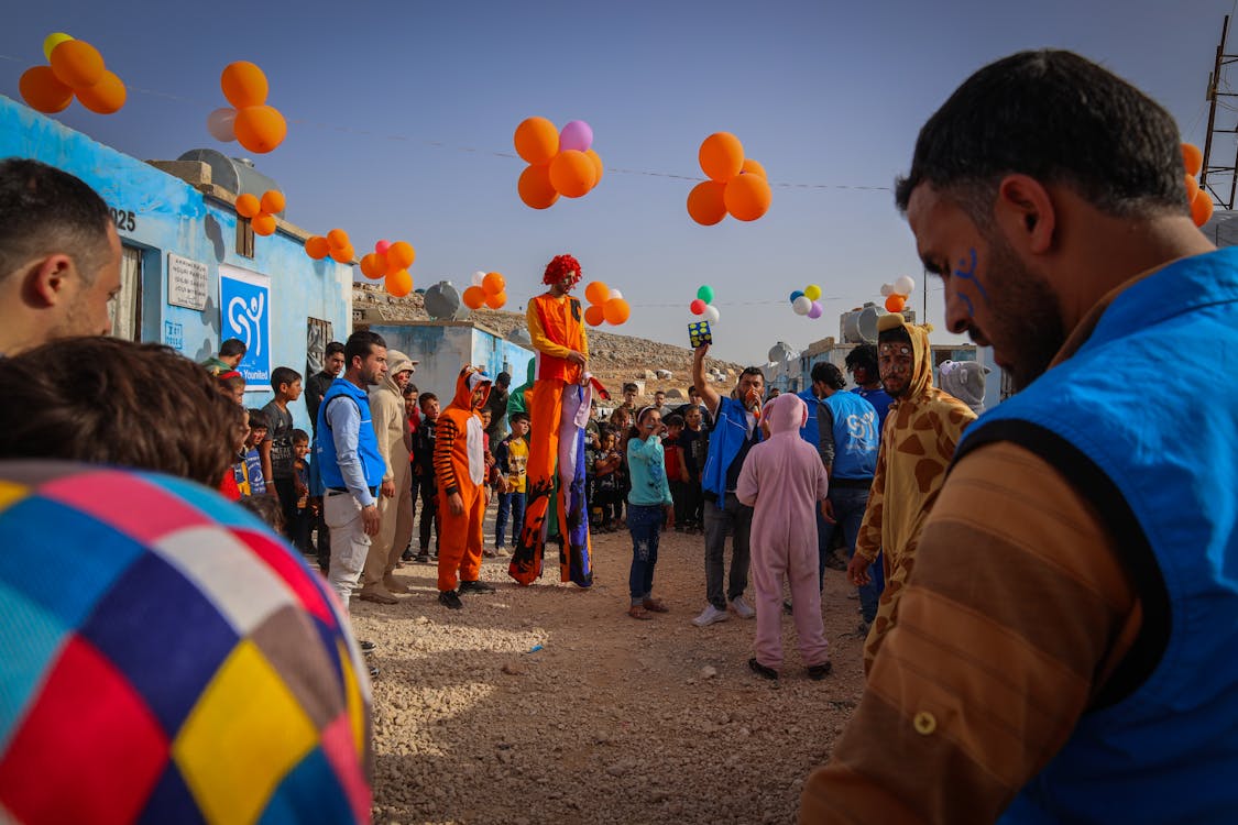 Free Men Wearing Animal Costumes Performing on the Street Stock Photo