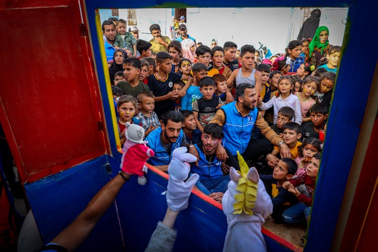 Kids Watching A Puppet Show