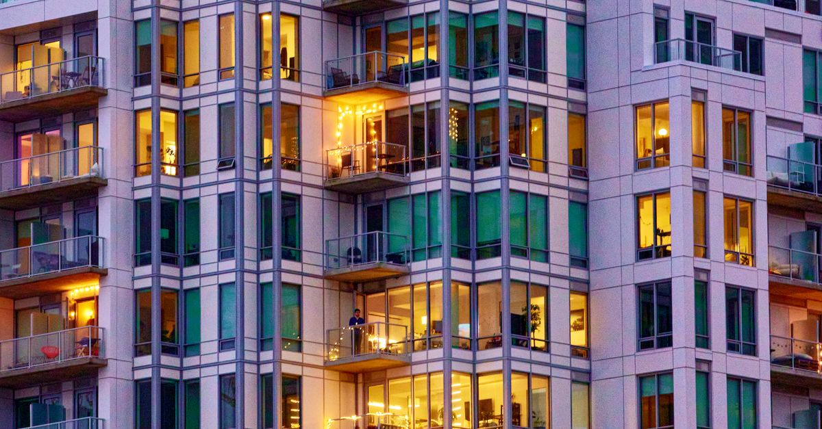 View of Skyscraper with Illuminated Apartments · Free Stock Photo