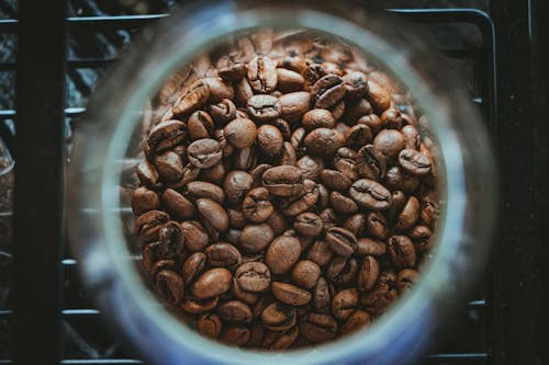 Free Close-up Photo of Coffee Beans in a Container Stock Photo