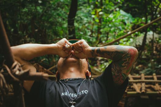 Man in Black Crew Neck T-shirt With Tattoo on His Right Hand