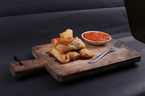 Spring Rolls on Wooden Chopping Board