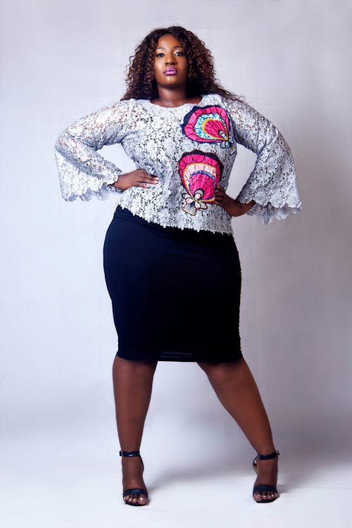 Woman Standing in Front of White Wall