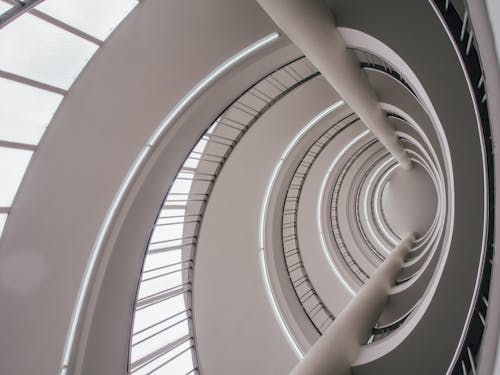 White Spiral Staircase With White Metal Railings