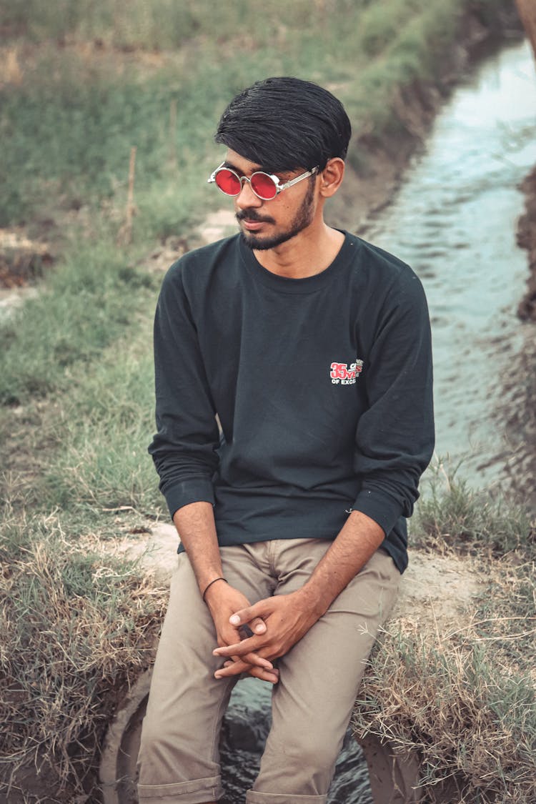 Man In Black Long Sleeves Wearing Sunglasses