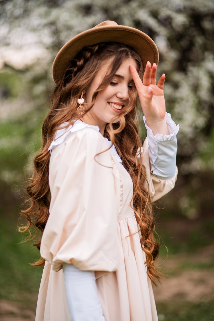 Portrait Of Smiling Ginger Hair Young Woman In Hat