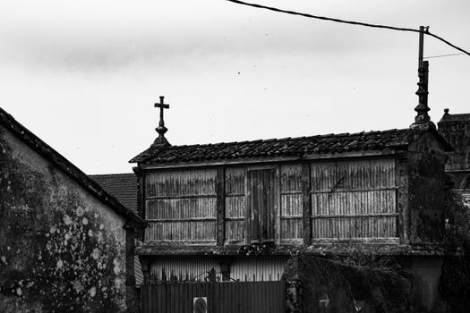 Grayscale Photo of a Wooden Horreo