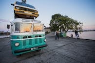 Yellow And White Vehicle On Top Of Another Vehicle