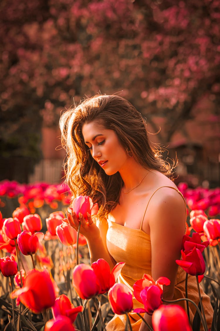 Beautiful Woman In A Tulip Garden