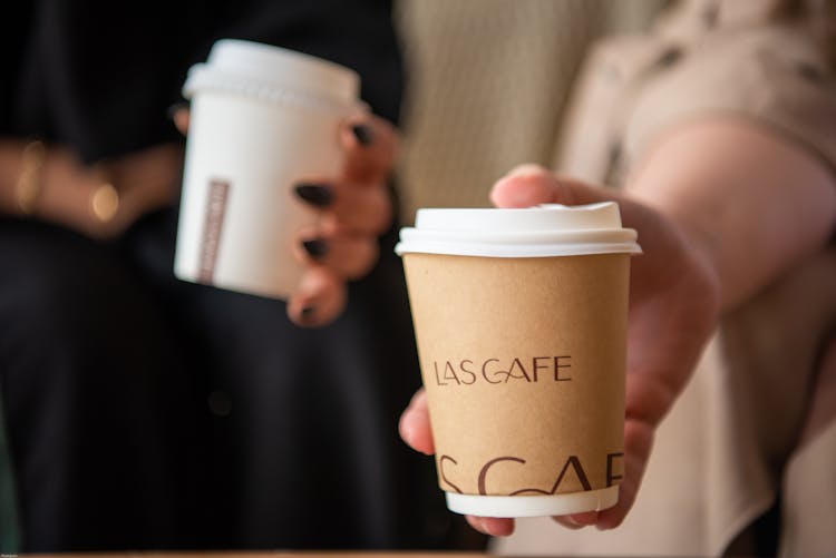 Person Holding A Coffee Cup