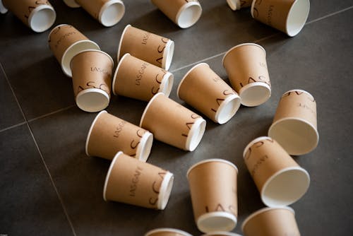 Free Paper Coffee Cups on the Floor Stock Photo