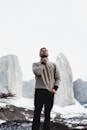 Man in Gray Sweater Standing Near Mountain