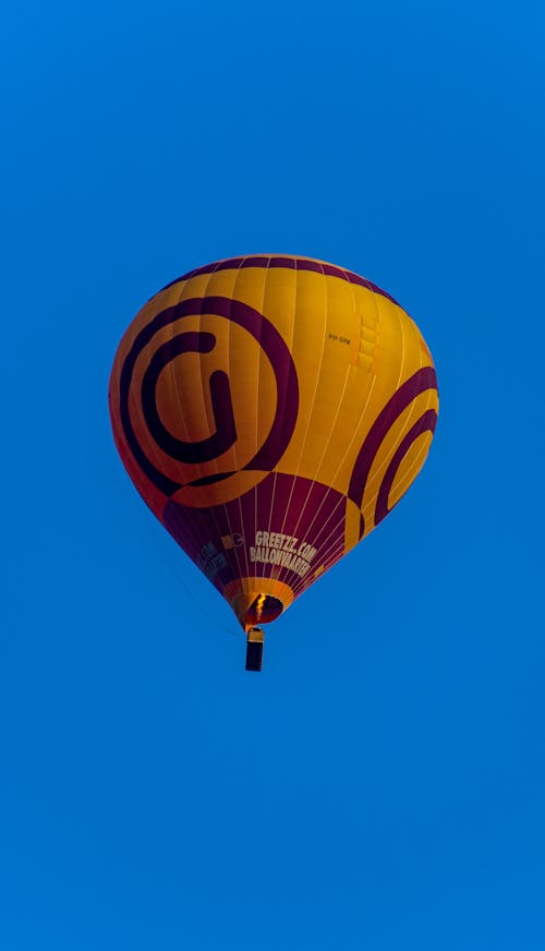 Maroon and Yellow Hot Air Balloon