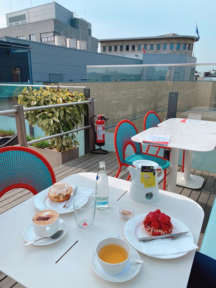 Empty Chairs Near Tables With Food And Beverage