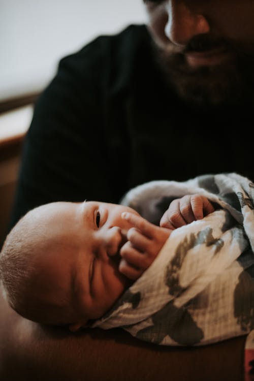 Free Close-up of a Father Carrying a Baby Stock Photo