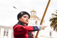 Boy in Red Long Sleeve Shirt Holding Brown Wooden Stick