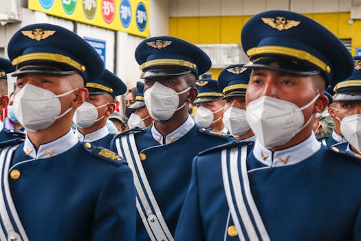 Ecuadorian military officers in masks and ceremonial uniforms during a parade.
