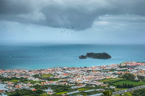 Aerial Photography of Village Near Body of Water