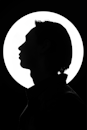 Silhouette of a Person Head in Front of a Spotlight