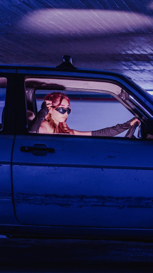 Woman Wearing Sunglasses Inside a Car