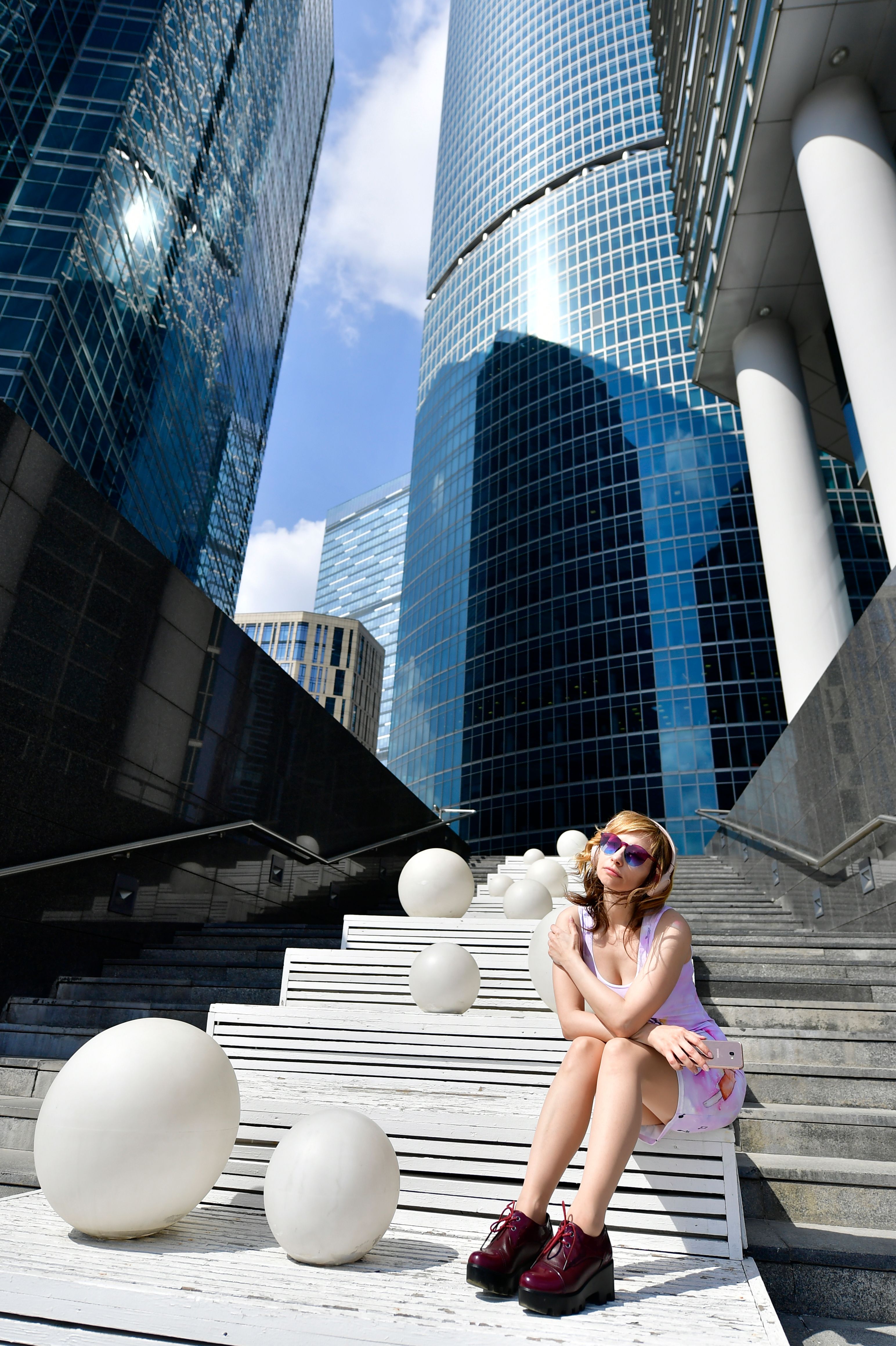 A woman in Pink Outfit Sitting on the Stairway · Free Stock Photo
