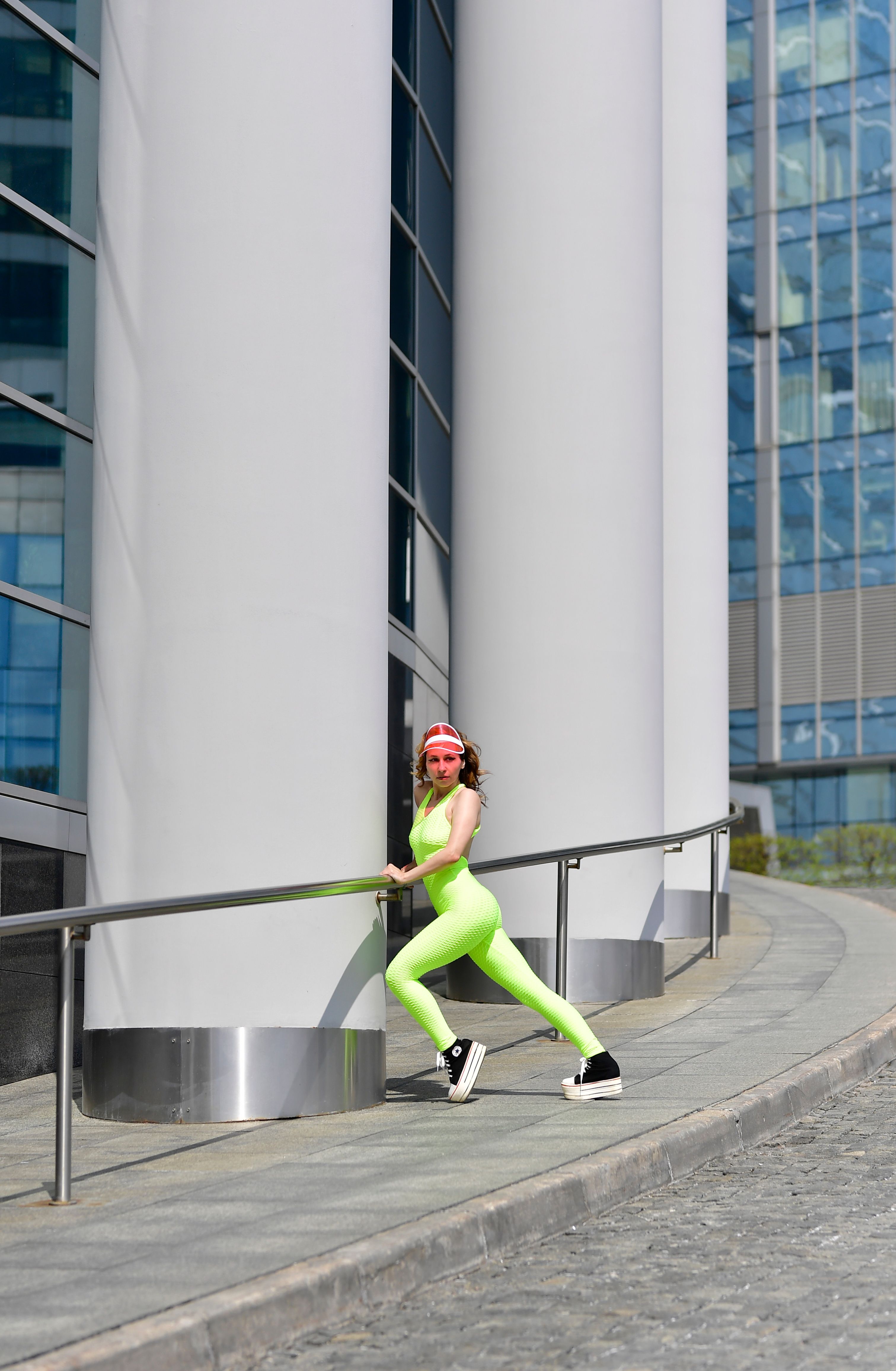 A Woman Holding on Stainless Steel Railings · Free Stock Photo