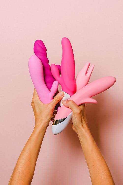 Woman Hands Holding Pink Accessories